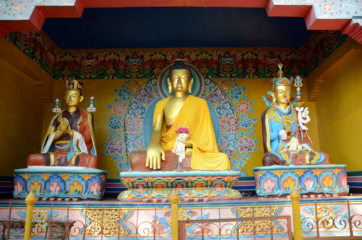 Pokhara Karma Dubgyu Chokhorling Monastery 03 Statues Of Shakyamuni Buddha and Padmasambhava Guru Rinpoche In The Garden At The Entrance Pathway 